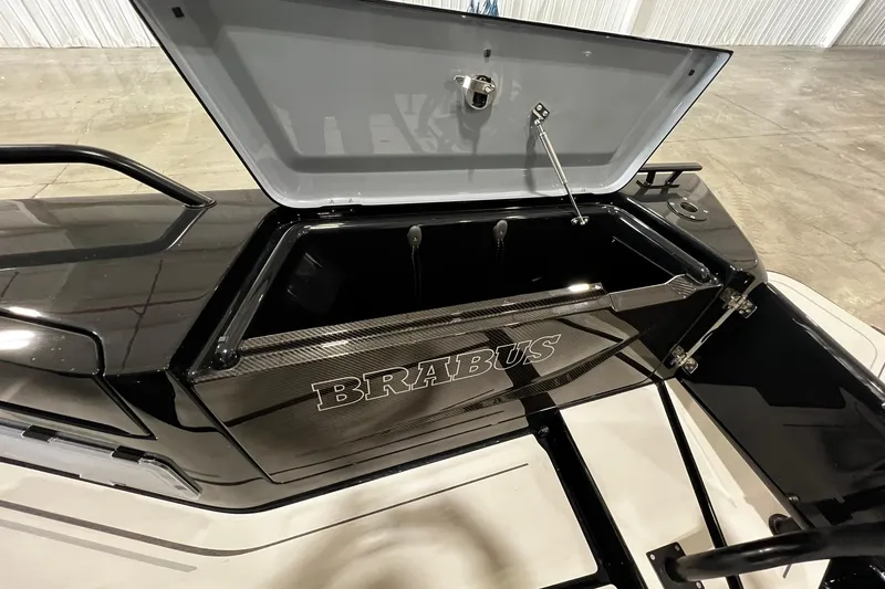 Slide: The Image of Open storage compartment of 2024 BRABUS Shadow 1000XC boat, showcasing sleek design. - 6