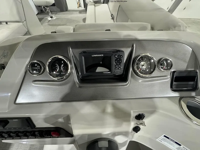 Slide: The Image of Dashboard of 2024 Crest Classic LX 220 boat with Lowrance display and gauges. - 16