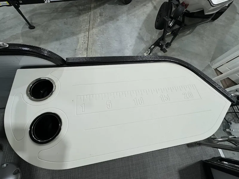 Slide: The Image of 2024 Crest Classic LX 220 boat with built-in measuring board and cup holders. - 18