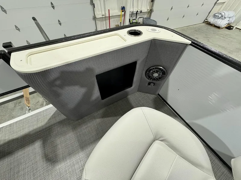 Slide: The Image of 2024 Crest Classic LX 220 boat interior with seating and control panel. - 7