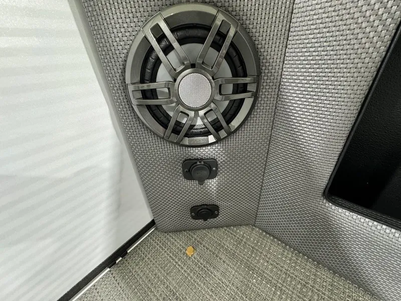 Slide: The Image of 2024 Crest Classic LX 220 boat interior speaker and control panel. - 9