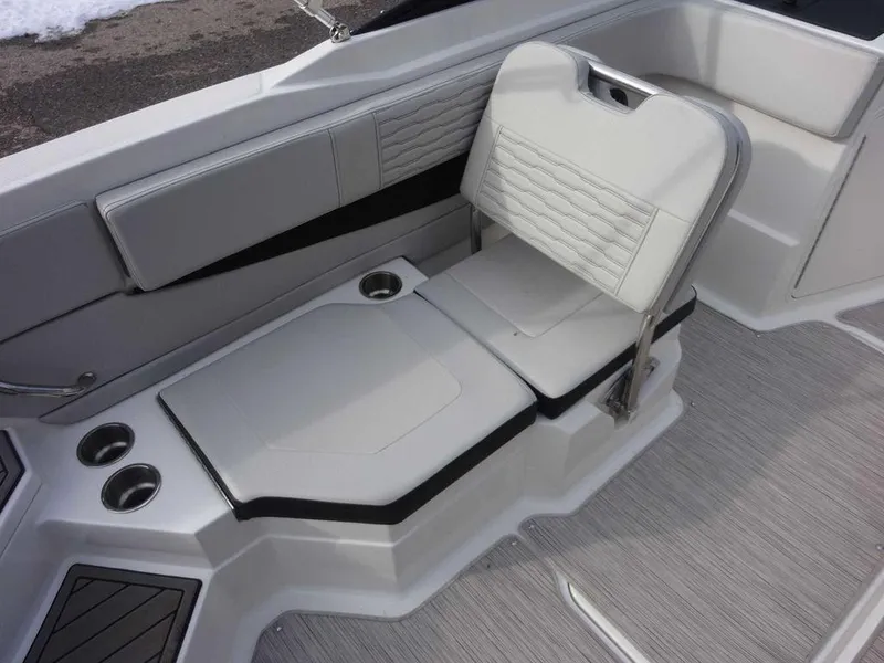 Slide: The Image of 2023 Sea Ray SPX 210 boat interior seating with cup holders. - 12