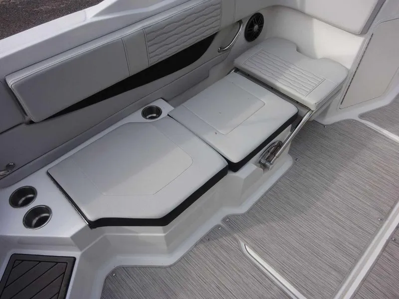 Slide: The Image of 2023 Sea Ray SPX 210 boat interior seating and cup holders. - 13
