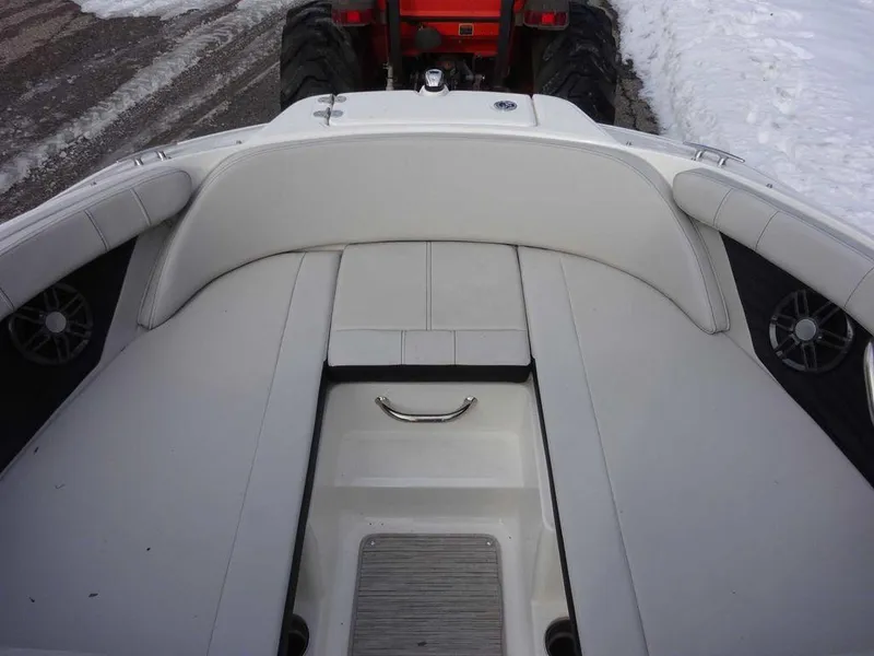 Slide: The Image of 2023 Sea Ray SPX 210 boat interior with white seating and speakers. - 19