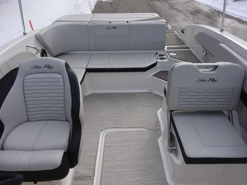 Slide: The Image of 2023 Sea Ray SPX 210 boat interior with gray seating and logo embroidery. - 21