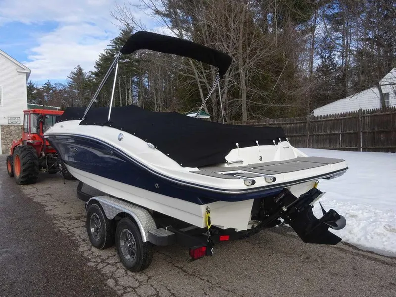 Slide: The Image of 2023 Sea Ray SPX 210 boat on a trailer, covered and ready for transport. - 4