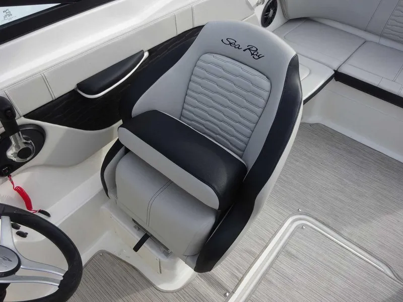 Slide: The Image of 2023 Sea Ray SPX 210 boat interior with captain's chair. - 9