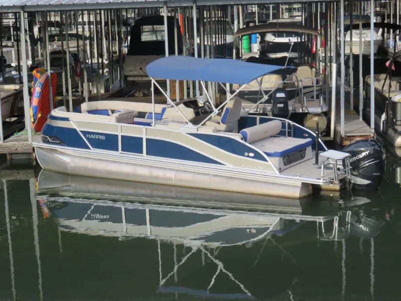 The Image of 2022 Harris Grand Mariner 250 pontoon boat docked in marina. - 1