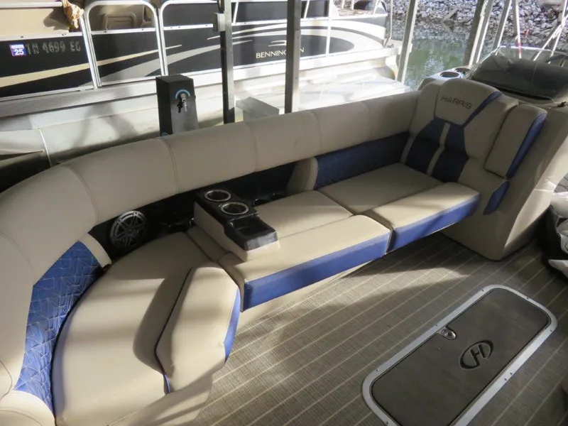 Slide: The Image of 2022 Harris Grand Mariner 250 boat interior with beige and blue seating. - 10