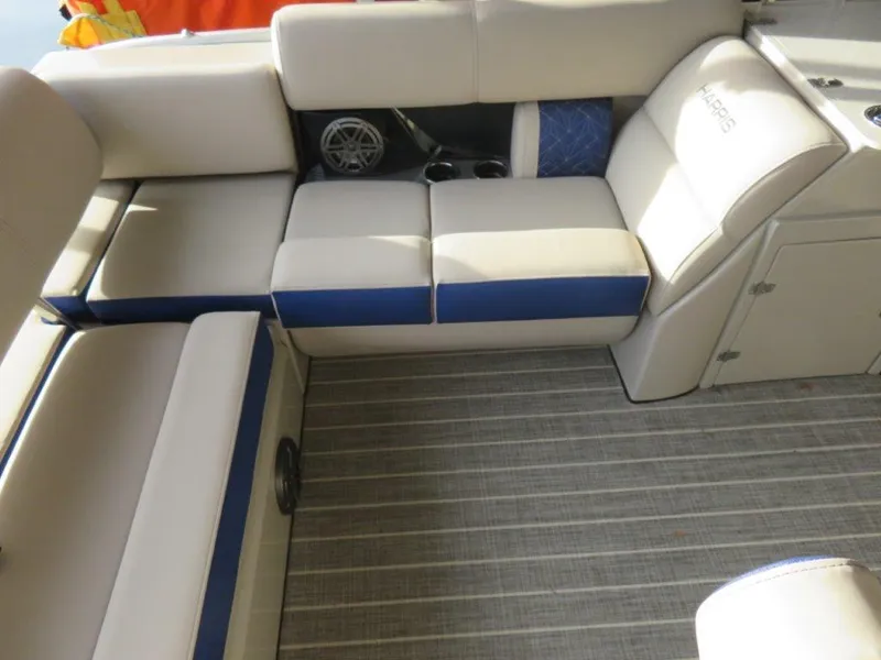 Slide: The Image of 2022 Harris Grand Mariner 250 boat interior with beige and blue seating. - 5