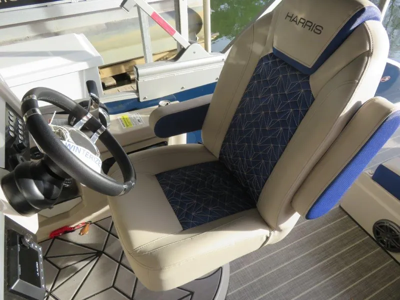 Slide: The Image of Captain's chair and steering wheel of a 2022 Harris Grand Mariner 250 boat. - 6