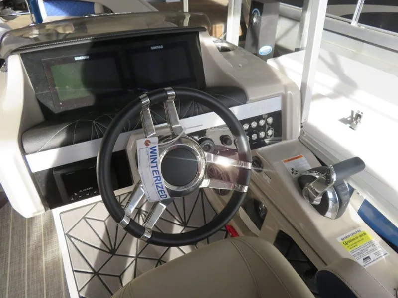 Slide: The Image of 2022 Harris Grand Mariner 250 boat dashboard with steering wheel and controls. - 7