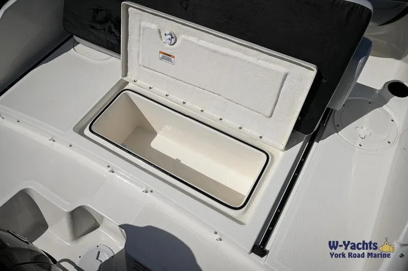 Slide: The Image of 2024 Bayliner M19 boat storage compartment open, showcasing spacious interior. - 16