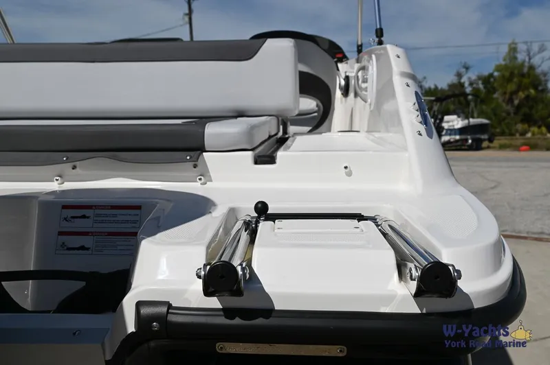 Slide: The Image of 2024 Bayliner M19 boat stern with seating and ladder. - 17