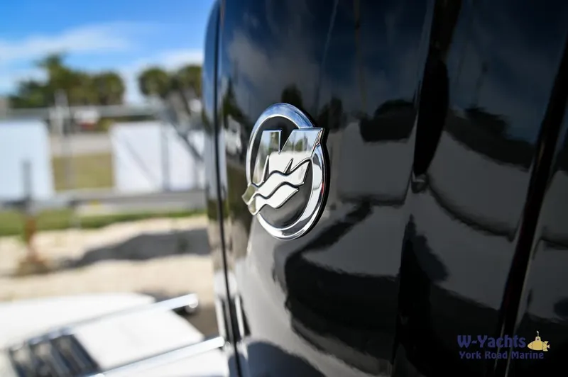 Slide: The Image of Close-up of 2024 Bayliner M19 boat logo in a marina. - 19