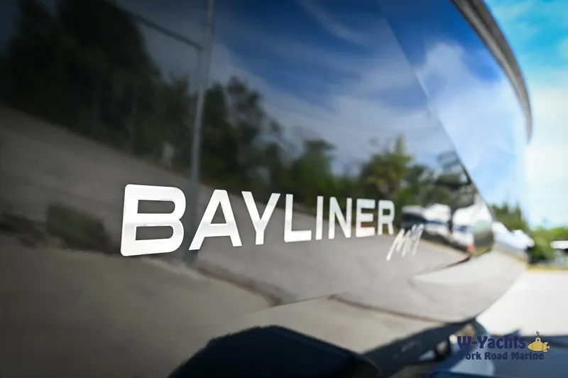 Slide: The Image of Close-up of 2024 Bayliner M19 boat exterior with logo. - 21