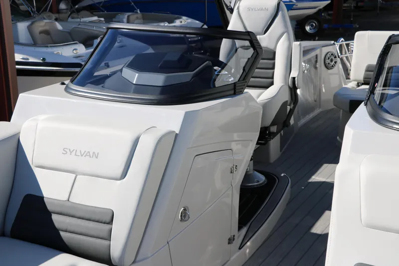 Slide: The Image of 2024 Sylvan G5 CLZ DC boat interior with modern seating and dashboard. - 27