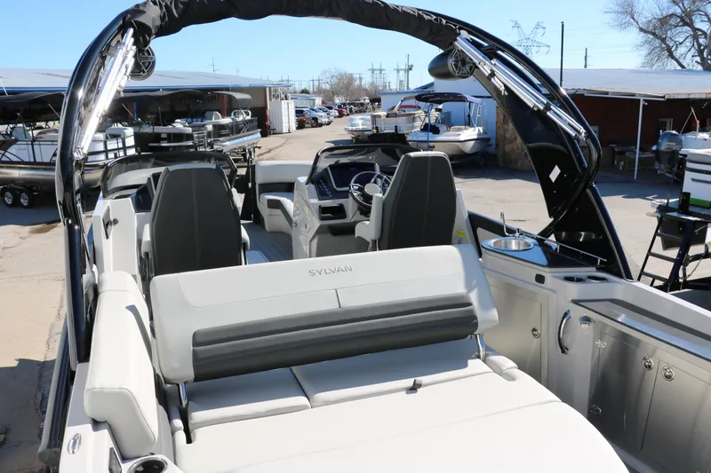 Slide: The Image of 2024 Sylvan G5 CLZ DC boat interior with seating and helm station. - 28