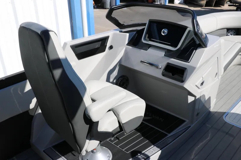 Slide: The Image of 2024 Sylvan G5 CLZ DC boat cockpit with modern helm and captain's chair. - 35