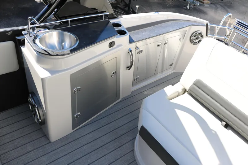 Slide: The Image of 2024 Sylvan G5 CLZ DC boat interior with kitchenette and seating area. - 41