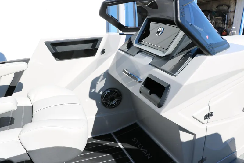 Slide: The Image of 2024 Sylvan G5 CLZ DC boat interior with modern dashboard and comfortable seating. - 48