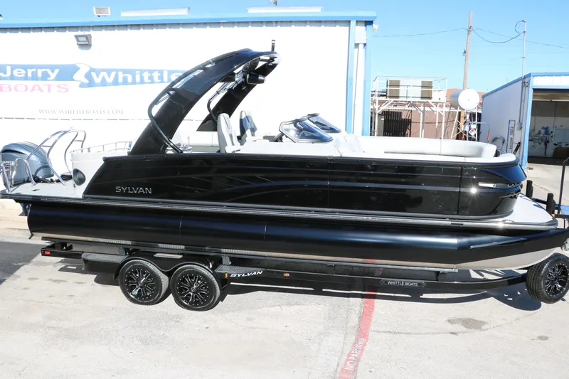 Slide: The Image of 2024 Sylvan G5 CLZ DC pontoon boat on a trailer outside a dealership. - 6