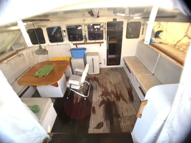 Slide: The Image of Interior of 1998 Catamaran Vision 51, featuring spacious seating and dining area. - 18