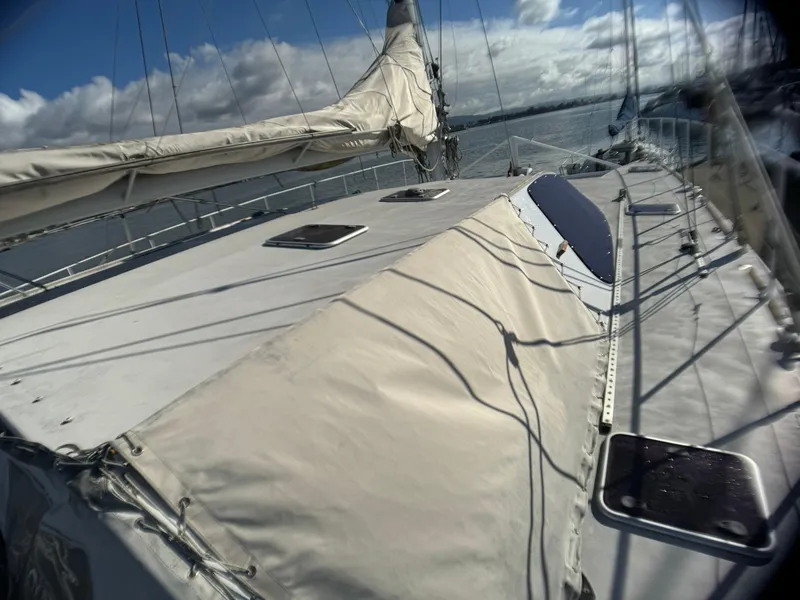 Slide: The Image of Catamaran Vision 51, 1998 model, sailing on open water under a cloudy sky. - 19