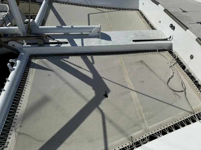 Slide: The Image of Catamaran Vision 51 (1998) trampoline netting with shadows and structural details. - 20