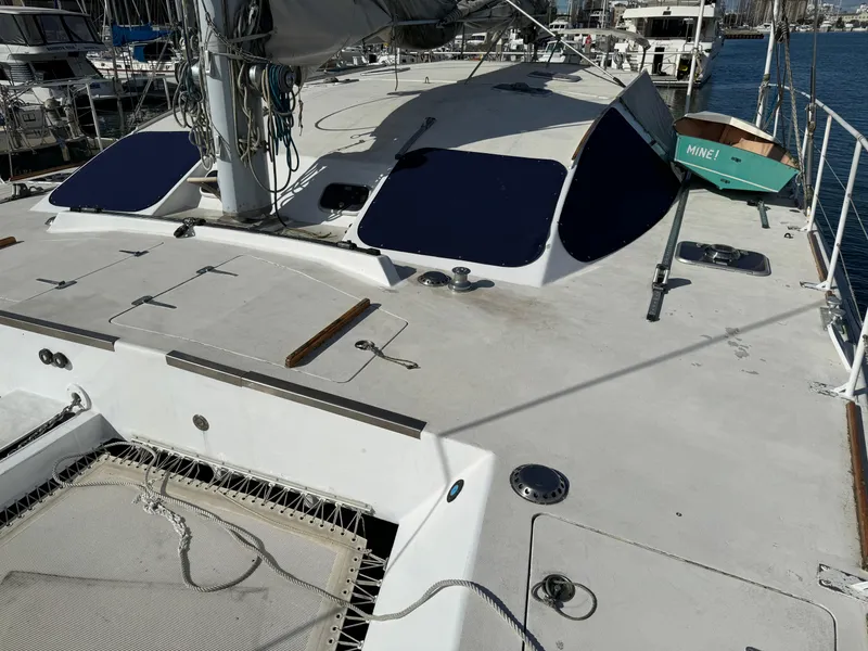 Slide: The Image of Catamaran Vision 51, 1998 model, docked with visible deck and rigging. - 21