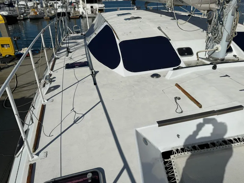 Slide: The Image of Catamaran Vision 51, 1998 model, docked at marina with visible deck and rigging. - 22