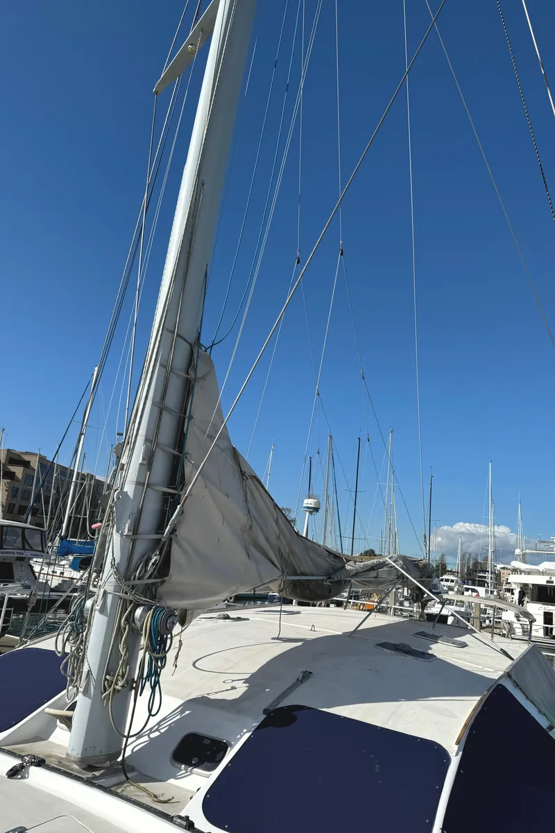 Slide: The Image of Sailing catamaran Vision 51, 1998 model, docked under clear blue sky. - 23
