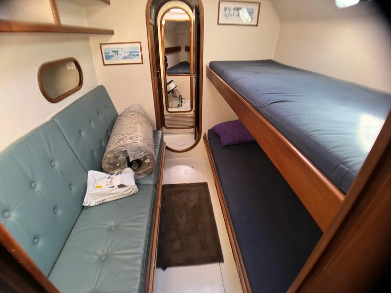Slide: The Image of Cozy cabin interior of 1998 Catamaran Vision 51 with bunk beds and seating area. - 7