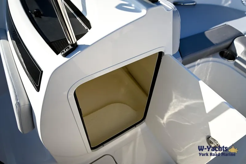 Slide: The Image of 2024 Bayliner VR5 boat interior storage compartment, white and clean design. - 12