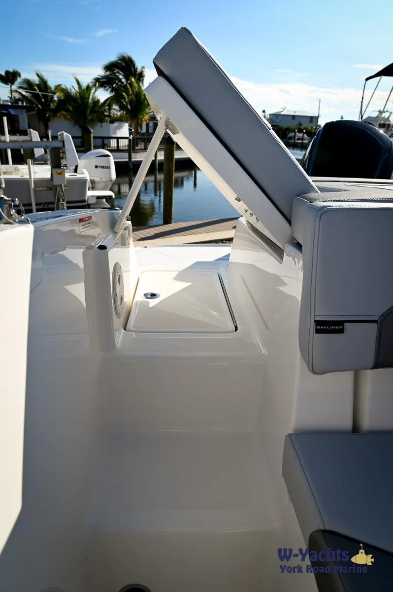 Slide: The Image of 2024 Bayliner VR5 boat interior with open storage compartment. - 21