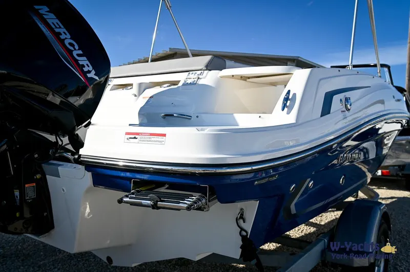 Slide: The Image of 2024 Bayliner VR5 boat with Mercury outboard motor, rear view. - 29