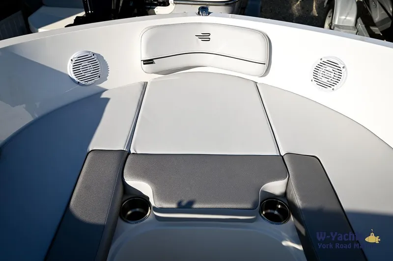 Slide: The Image of 2024 Bayliner VR5 boat bow seating area with speakers and cup holders. - 3