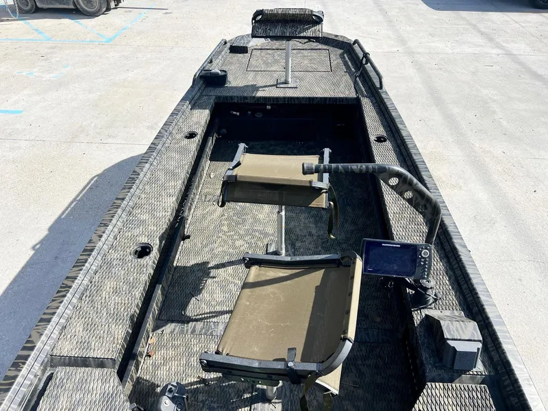 Slide: The Image of 2022 Prodigy 1751 boat interior with seating and navigation equipment. - 7