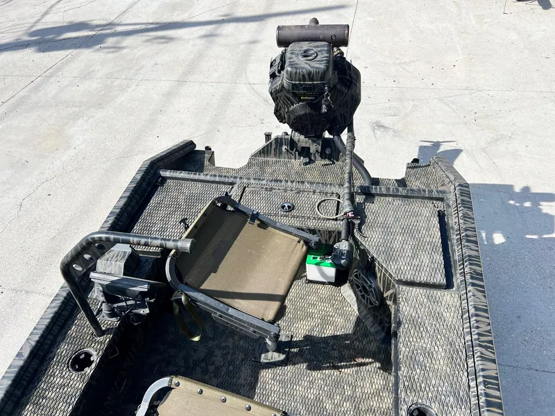 Slide: The Image of 2022 Prodigy 1751 boat interior with motor and seating. - 8