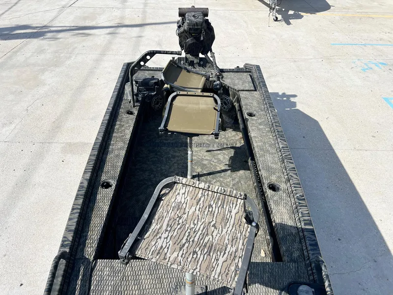 Slide: The Image of 2022 Prodigy 1751 boat with camouflage seating and motor. - 9