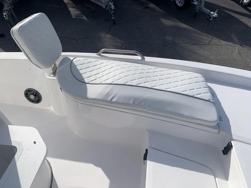 Slide: The Image of 2024 Sea Fox 231 Bay Fox boat with white cushioned seating. - 10