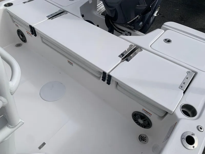 Slide: The Image of 2024 Sea Fox 231 Bay Fox boat interior with storage compartments and seating. - 16