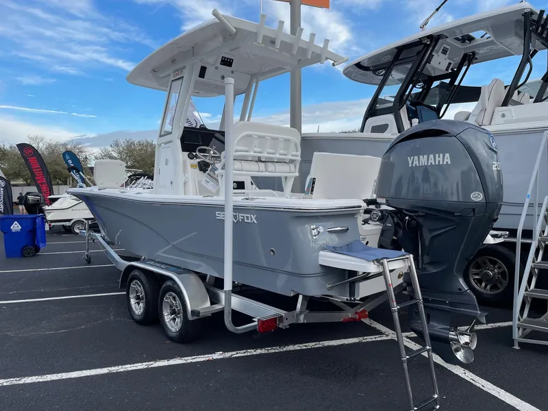 Slide: The Image of 2024 Sea Fox 231 Bay Fox boat with Yamaha outboard motor on trailer. - 2
