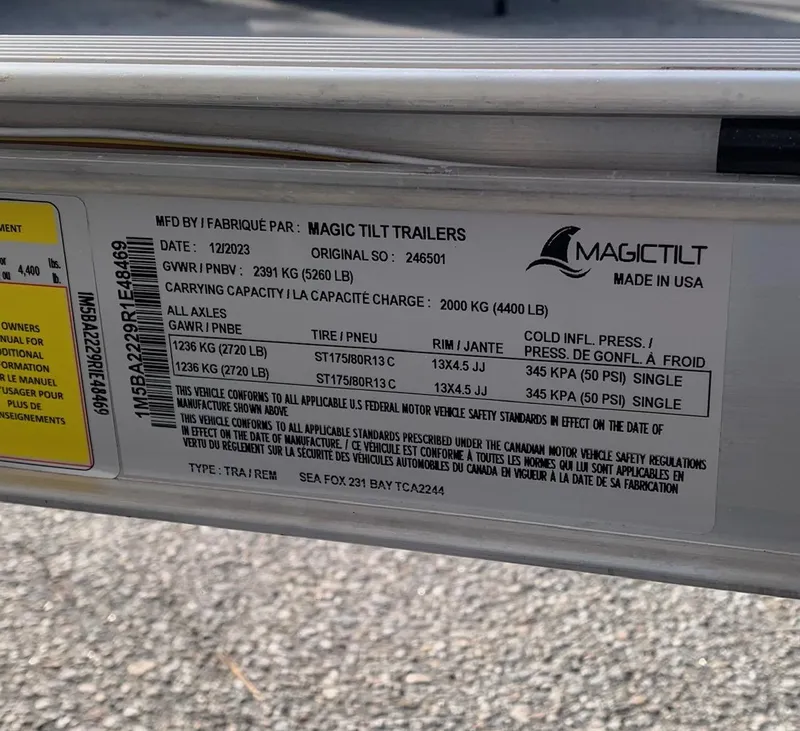 Slide: The Image of Label on Magic Tilt Trailer for 2024 Sea Fox 231 Bay Fox, showing specifications and tire information. - 21