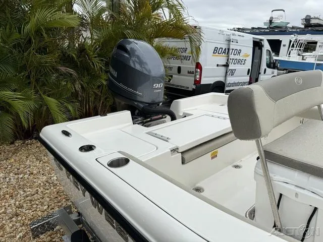 Slide: The Image of 2024 Key West 179 FS boat, white interior, parked at dealership. - 10
