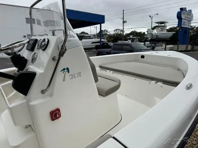 Slide: The Image of 2024 Key West 179 FS boat interior with steering console and seating. - 11