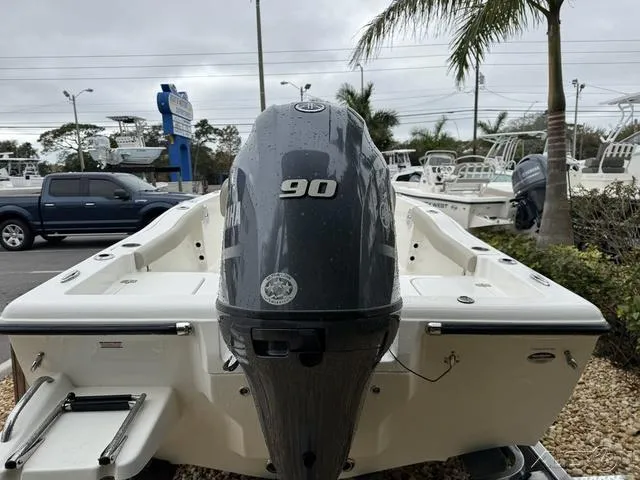 Slide: The Image of 2024 Key West 179 FS boat with Yamaha outboard motor, displayed outdoors. - 15