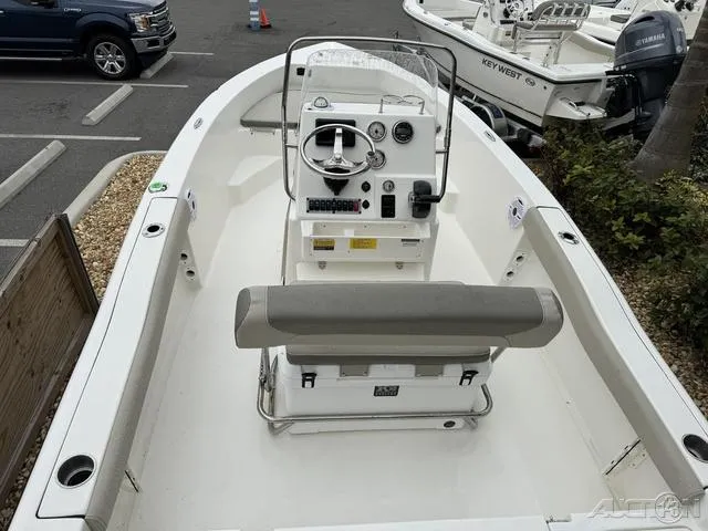 Slide: The Image of 2024 Key West 179 FS boat dashboard with steering wheel and controls. - 17