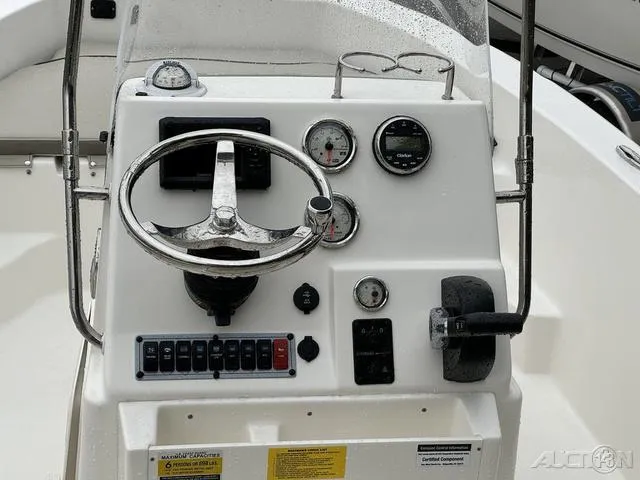 Slide: The Image of 2024 Key West 179 FS boat interior with console and seating. - 19