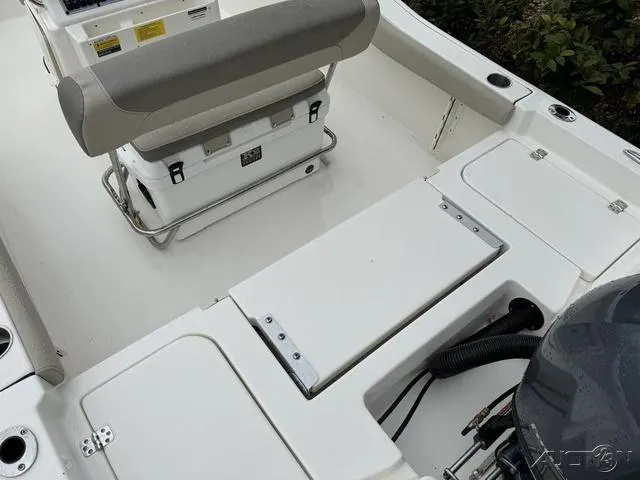 Slide: The Image of 2024 Key West 179 FS boat, white interior, parked outdoors. - 21